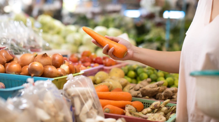Woman shopping organic vegetables fruits
